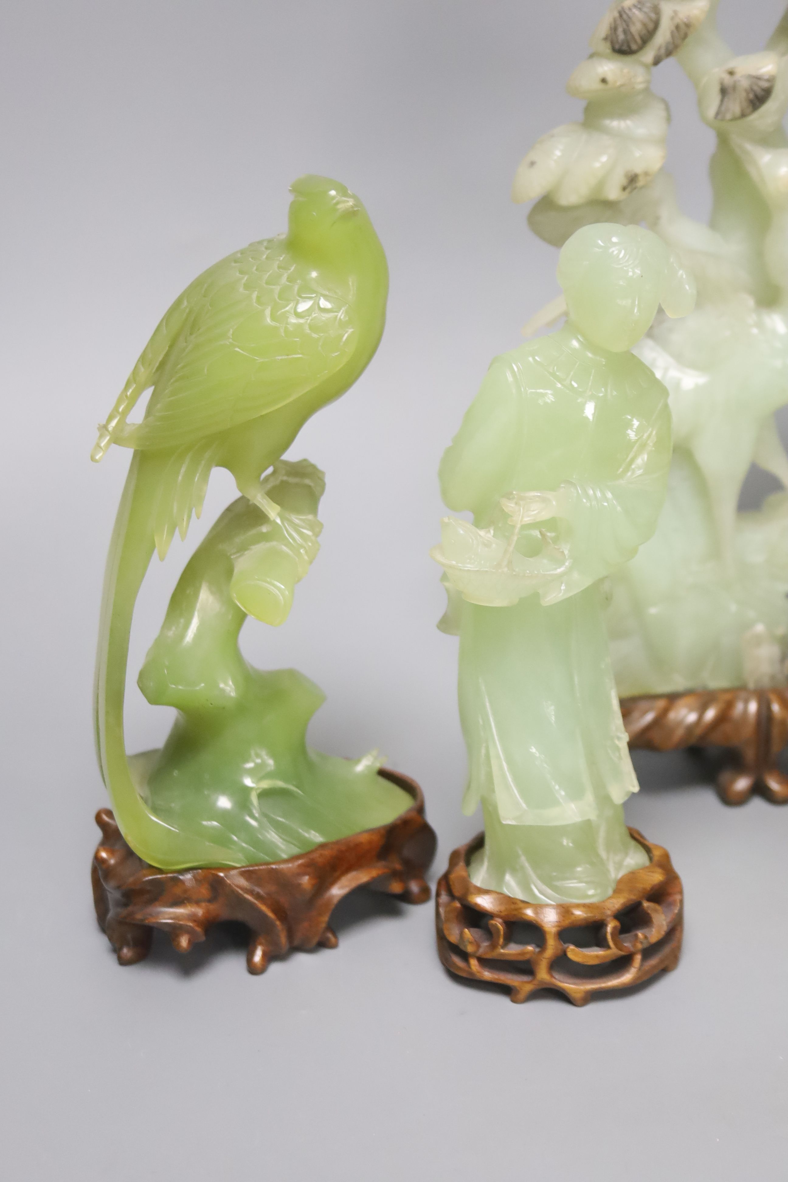 A pair of Chinese bowenite carvings of exotic birds on a branch and four Chinese hardstone items,